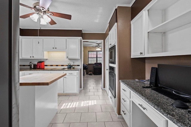 6995 Limerick Dr, Beaumont, TX 77706 - kitchen with butcher block counters, ceiling fan, open shelves, appliances with stainless steel finishes, and a textured ceiling