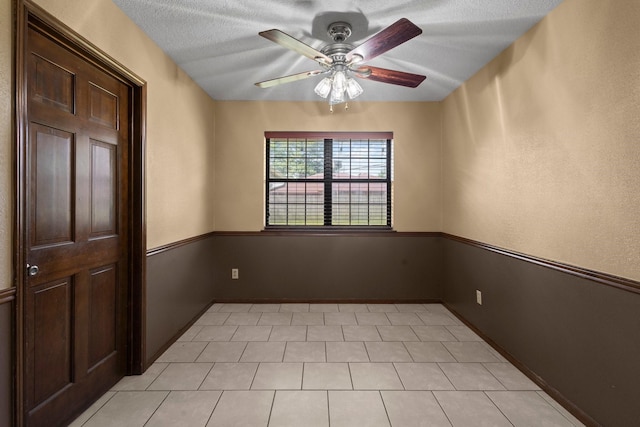 6995 Limerick Dr, Beaumont, TX 77706 - empty room with a ceiling fan and a textured ceiling