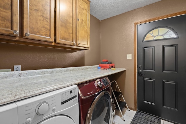 6995 Limerick Dr, Beaumont, TX 77706 - washroom with independent washer and dryer, cabinet space, a textured ceiling, tile patterned flooring, and a textured wall