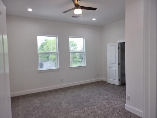 3013 Sparrow St, Houston, TX 77051 - spare room featuring dark carpet, a ceiling fan, and recessed lighting