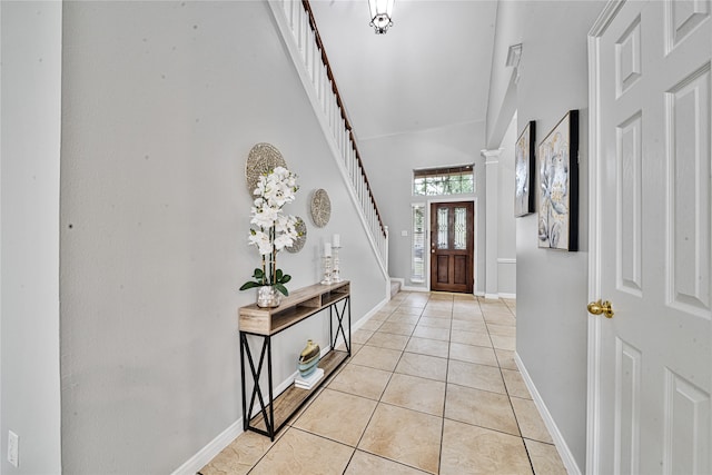 22406 Cascade Springs Dr, Katy, TX 77494 - foyer with light tile patterned floors and stairway