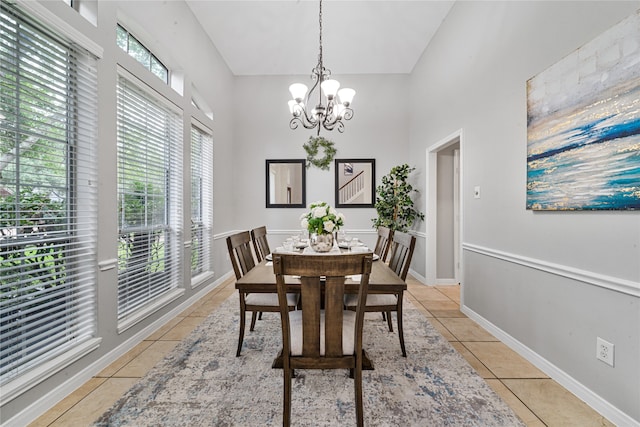 22406 Cascade Springs Dr, Katy, TX 77494 - dining space featuring high vaulted ceiling, light tile patterned floors, and a chandelier