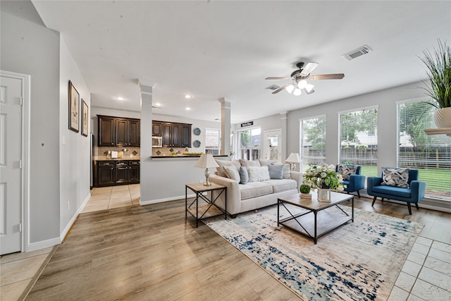 22406 Cascade Springs Dr, Katy, TX 77494 - living area featuring ornate columns, a ceiling fan, recessed lighting, and light wood finished floors