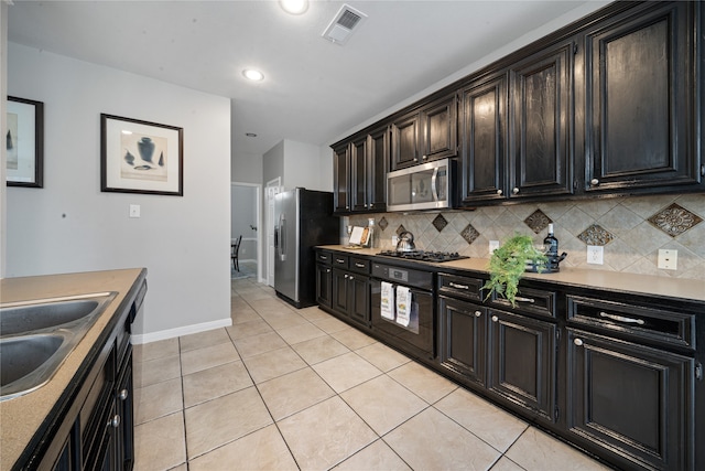 22406 Cascade Springs Dr, Katy, TX 77494 - kitchen featuring stainless steel appliances, decorative backsplash, light tile patterned floors, light countertops, and recessed lighting