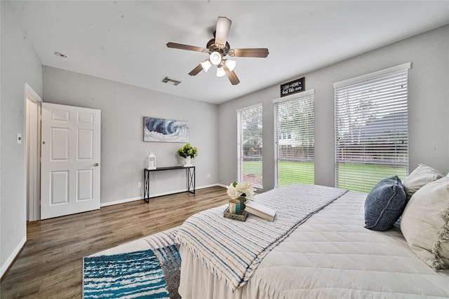22406 Cascade Springs Dr, Katy, TX 77494 - bedroom with wood finished floors and ceiling fan