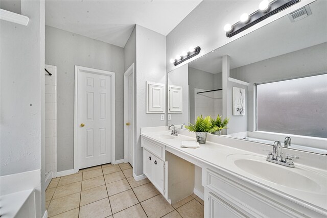 22406 Cascade Springs Dr, Katy, TX 77494 - bathroom with double vanity, tile patterned floors, and a walk in shower