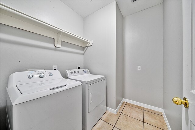 22406 Cascade Springs Dr, Katy, TX 77494 - laundry area with washer and dryer and light tile patterned flooring