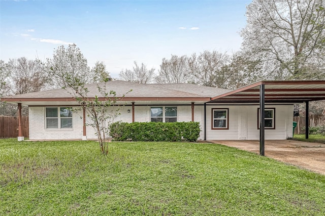 2307 N Thompson, Conroe, TX 77303 - ranch-style house with a carport, driveway, roof with shingles, and brick siding