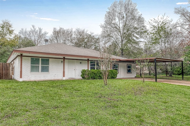 2307 N Thompson, Conroe, TX 77303 - view of front of property with an attached carport, brick siding, and roof with shingles