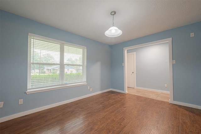 2307 N Thompson, Conroe, TX 77303 - unfurnished room with wood finished floors and baseboards
