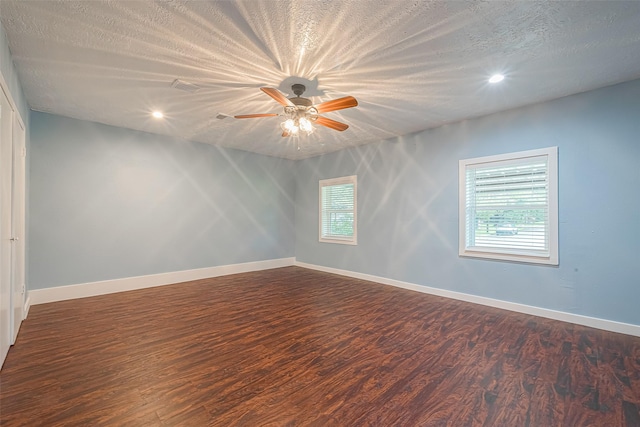 2307 N Thompson, Conroe, TX 77303 - empty room featuring dark wood-style flooring, ceiling fan, recessed lighting, and a textured ceiling