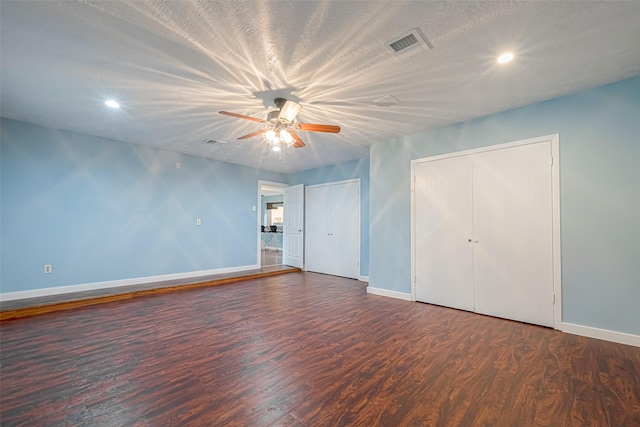 2307 N Thompson, Conroe, TX 77303 - unfurnished bedroom featuring wood finished floors, recessed lighting, multiple closets, and a ceiling fan