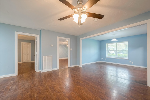 2307 N Thompson, Conroe, TX 77303 - empty room featuring a ceiling fan and dark wood-style flooring