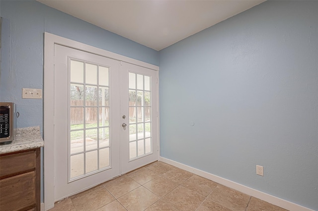 2307 N Thompson, Conroe, TX 77303 - doorway featuring french doors and light tile patterned floors
