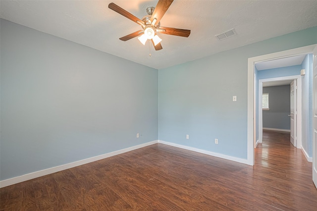 2307 N Thompson, Conroe, TX 77303 - unfurnished room with ceiling fan and dark wood-style floors