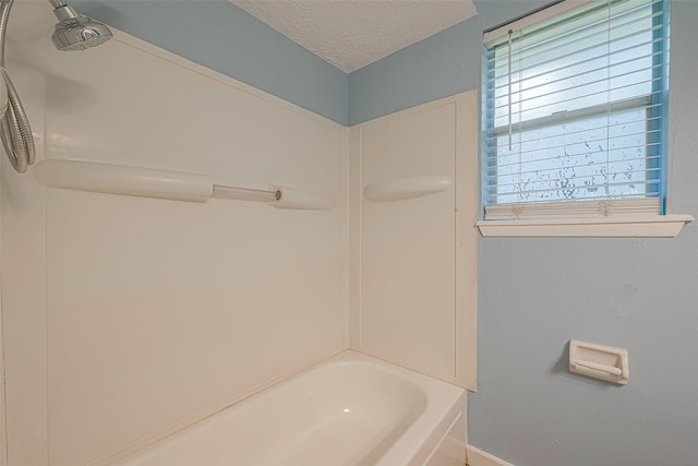2307 N Thompson, Conroe, TX 77303 - full bath with a textured ceiling and tub / shower combination