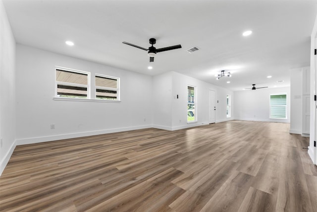 3112 Hays St, Pasadena, TX 77503 - unfurnished living room with a ceiling fan, recessed lighting, and wood finished floors