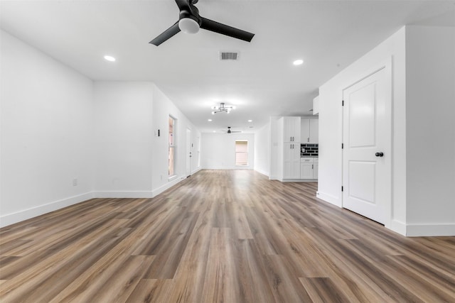 3112 Hays St, Pasadena, TX 77503 - unfurnished living room with a ceiling fan, wood finished floors, and recessed lighting