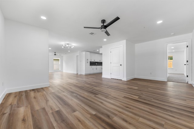 3112 Hays St, Pasadena, TX 77503 - unfurnished living room with a ceiling fan, plenty of natural light, wood finished floors, and recessed lighting