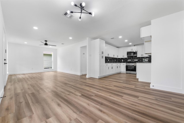 3112 Hays St, Pasadena, TX 77503 - unfurnished living room featuring recessed lighting, light wood-style floors, and a ceiling fan