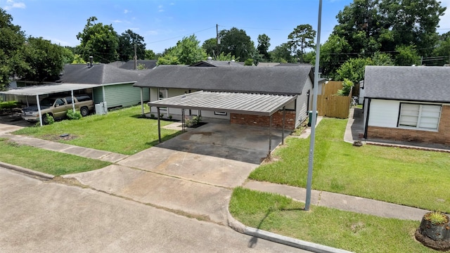 3112 Hays St, Pasadena, TX 77503 - view of front of house featuring brick siding, driveway, a front lawn, and a shingled roof