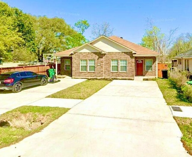 235 Calloway St, Houston, TX 77029 - view of front of property with driveway and brick siding