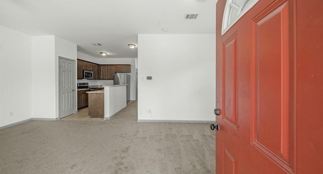 235 Calloway St, Houston, TX 77029 - entryway with light carpet and baseboards