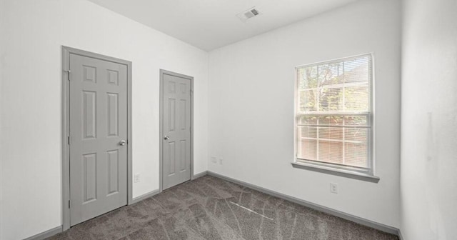 235 Calloway St, Houston, TX 77029 - unfurnished bedroom with carpet flooring and baseboards