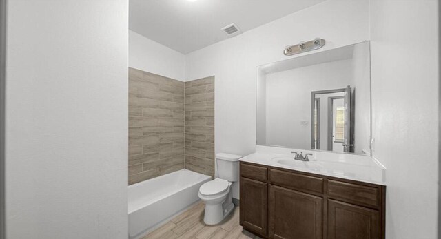 235 Calloway St, Houston, TX 77029 - bathroom featuring vanity, bathing tub / shower combination, and wood finished floors