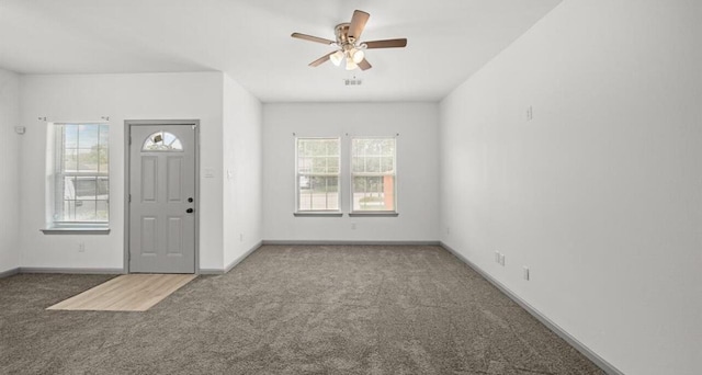 235 Calloway St, Houston, TX 77029 - carpeted foyer featuring ceiling fan and baseboards