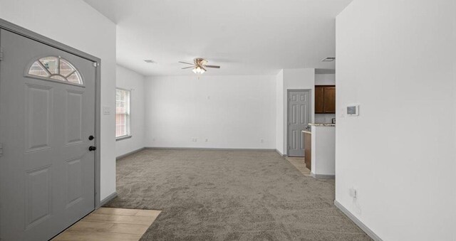 235 Calloway St, Houston, TX 77029 - foyer entrance featuring ceiling fan and light carpet