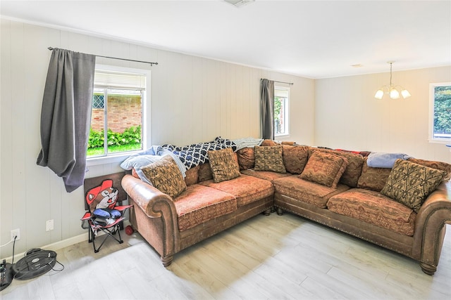 2706 Meadow Ln, La Marque, TX 77568 - living room with healthy amount of natural light, wood finished floors, and a chandelier