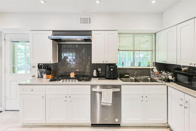 2706 Meadow Ln, La Marque, TX 77568 - kitchen featuring stainless steel appliances, exhaust hood, backsplash, white cabinets, and recessed lighting