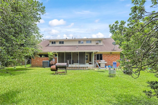 2706 Meadow Ln, La Marque, TX 77568 - rear view of property with a sunroom, brick siding, and a shingled roof