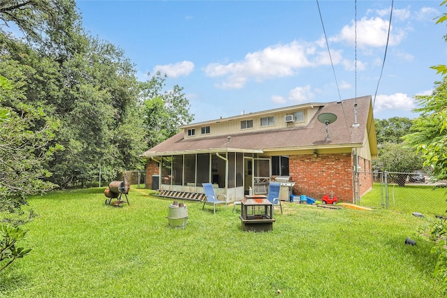 2706 Meadow Ln, La Marque, TX 77568 - back of house with a sunroom, brick siding, and roof with shingles