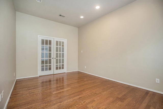 13604 Rainwater Dr, Pearland, TX 77584 - empty room featuring french doors, wood finished floors, and recessed lighting