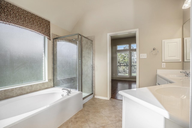 13604 Rainwater Dr, Pearland, TX 77584 - full bathroom featuring a garden tub, vanity, a stall shower, tile patterned floors, and lofted ceiling