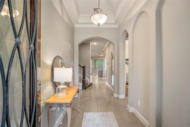 31218 Redwood Manor Ct, Spring, TX 77386 - tiled entryway with arched walkways, crown molding, a tray ceiling, and stairs