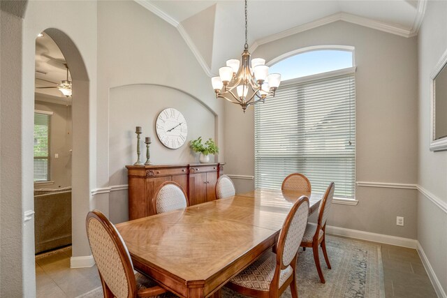 31218 Redwood Manor Ct, Spring, TX 77386 - dining space with a chandelier, vaulted ceiling, healthy amount of natural light, light tile patterned flooring, and ornamental molding