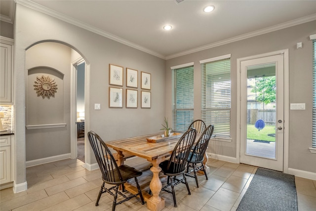 31218 Redwood Manor Ct, Spring, TX 77386 - dining space featuring ornamental molding, arched walkways, recessed lighting, and light tile patterned floors