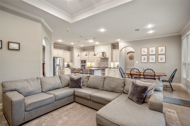 31218 Redwood Manor Ct, Spring, TX 77386 - living room featuring arched walkways, crown molding, and recessed lighting