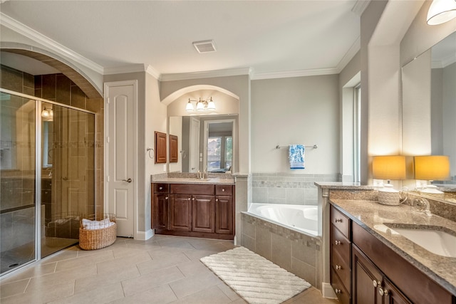 31218 Redwood Manor Ct, Spring, TX 77386 - bathroom with two vanities, a stall shower, a garden tub, tile patterned floors, and crown molding