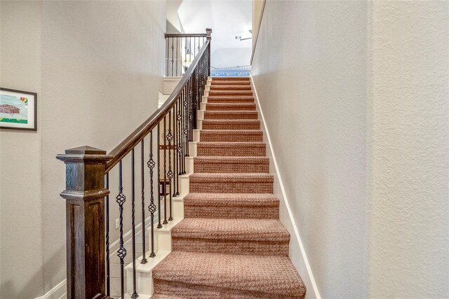 31218 Redwood Manor Ct, Spring, TX 77386 - stairway with a textured wall