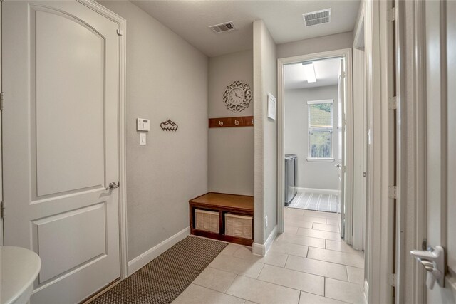 31218 Redwood Manor Ct, Spring, TX 77386 - mudroom featuring light tile patterned floors and baseboards