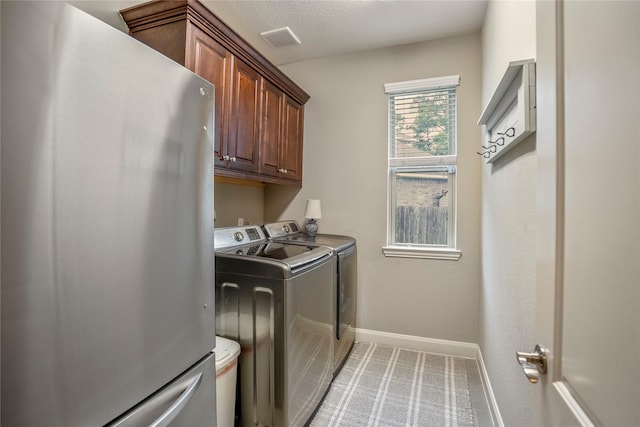 31218 Redwood Manor Ct, Spring, TX 77386 - laundry area featuring cabinet space, washer and dryer, and light colored carpet