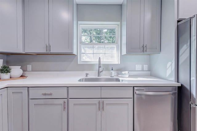 907 Kip Ln, Pinehurst, TX 77362 - kitchen featuring stainless steel appliances and light countertops