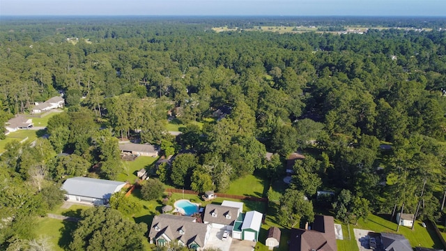 907 Kip Ln, Pinehurst, TX 77362 - aerial view of property and surrounding area with a heavily wooded area