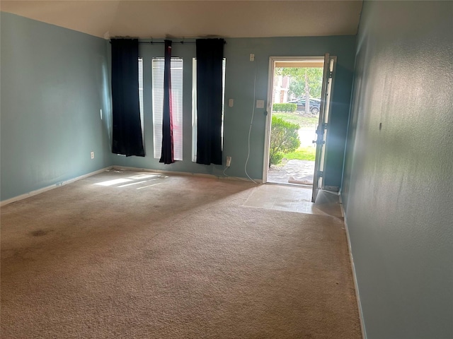 15806 Pin Oak Ridge St, Houston, TX 77073 - unfurnished living room with carpet floors and baseboards
