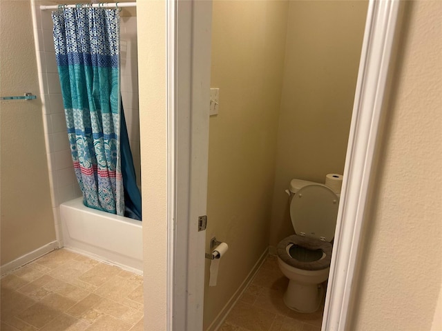 15806 Pin Oak Ridge St, Houston, TX 77073 - bathroom featuring toilet and shower / bathtub combination with curtain