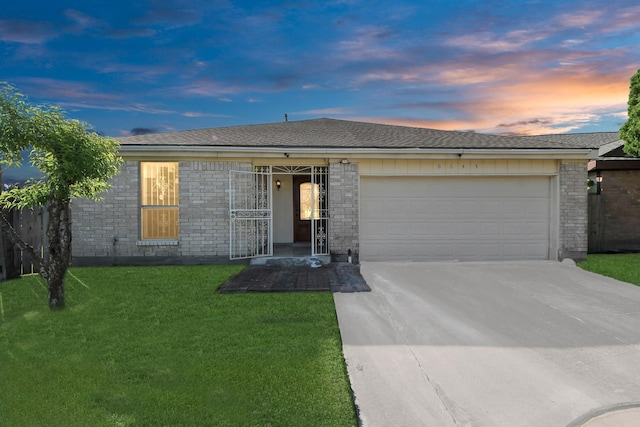 6643 Briar Glade Dr, Houston, TX 77072 - ranch-style home with driveway, an attached garage, a lawn, and brick siding